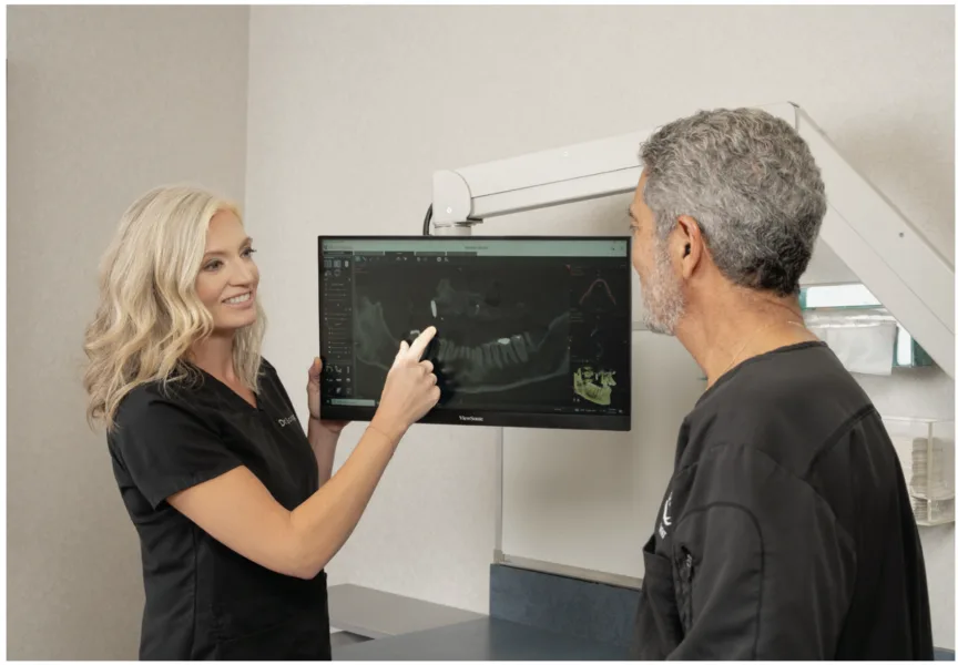 dr. scoggins (left) discusses a case with dr. gorab